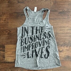 In the Business of Improving Lives Tank Top | Graphic Tee | Graphic Tank Top